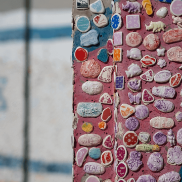 a wall of mosaic seashell with israel flag