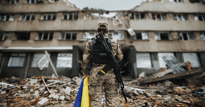 soldier standing infront of destroyed building