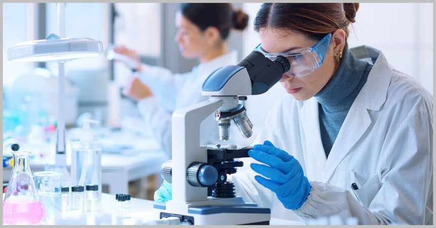 researcher using microscope