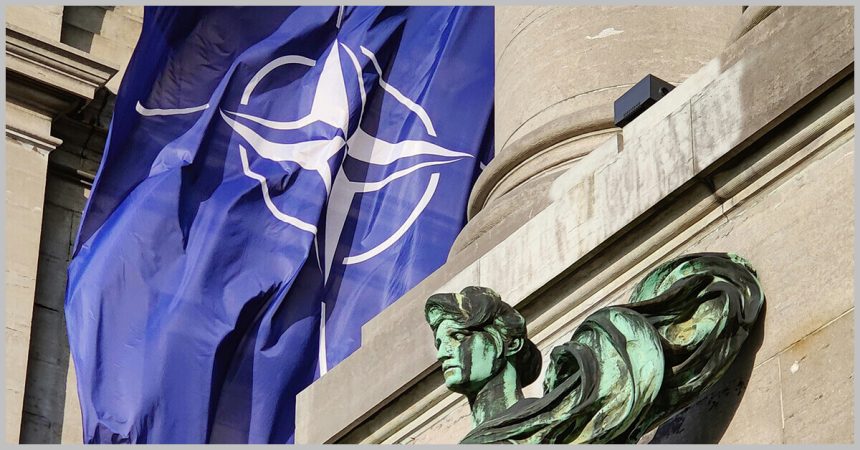 Nato Flag fluttering in Cinquantenaire Arcade